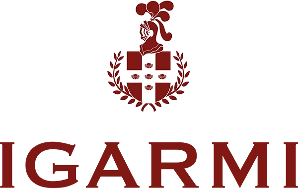 White banner bearing a maroon heraldic coat of arms with a shield flanked by laurel branches and a knight's helmet on top, set against a burgundy background.